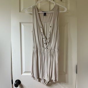 Gently worn beige jumpsuit. Size M